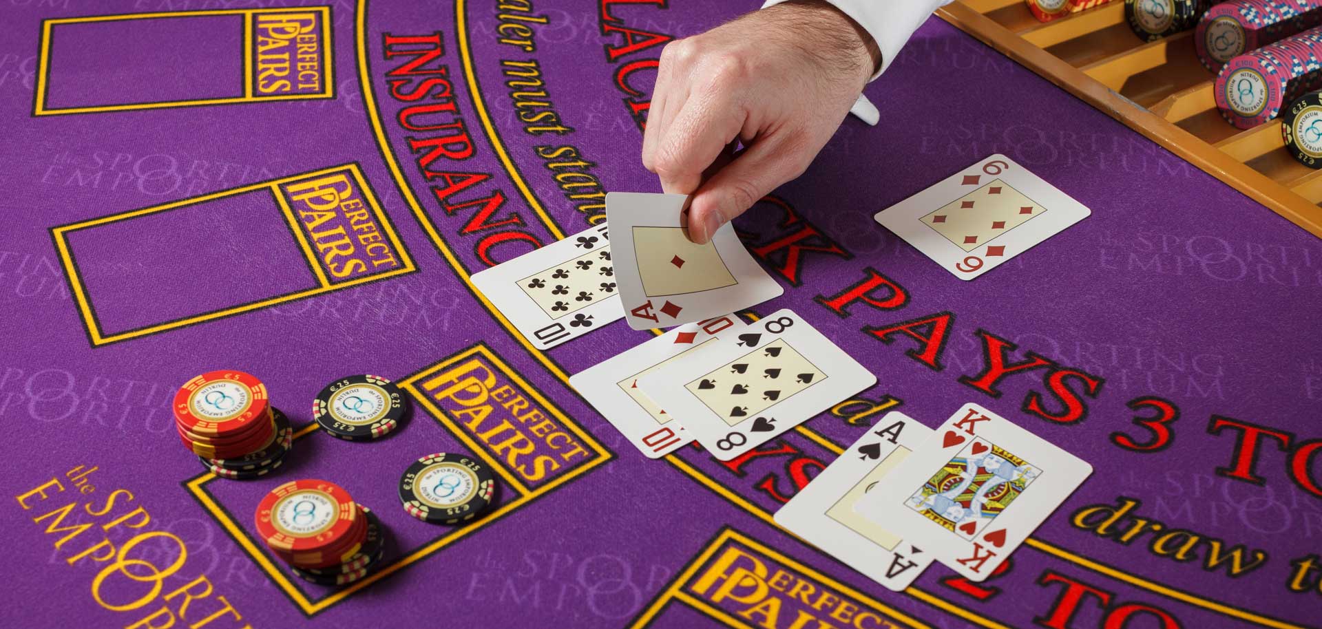 Cards and Tokens on Purple Blackjack Table