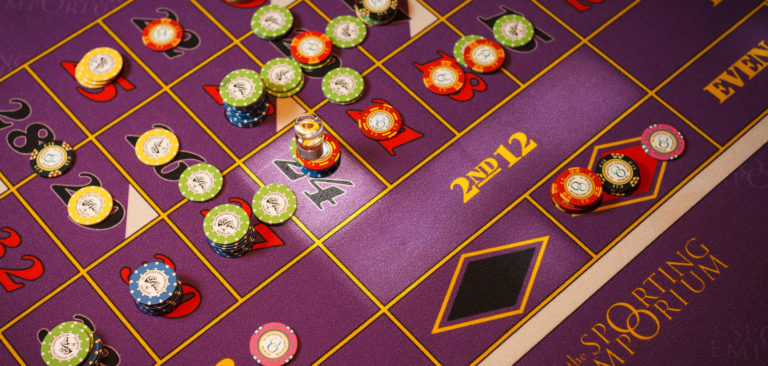 A roulette table with casino tokens